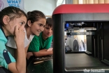 Students watch as the first 3D printer in all of Badakhshan province begins to print a model.