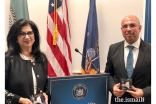 Minaz Fazal and Shajahan Merchant, posing with their awards.