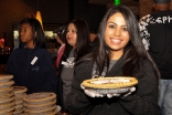 An Ismaili volunteer prepares Thanksgiving pumpkin pie as part of Operation Turkey to deliver meals for people in need in Dallas. Sara Maherali