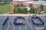 Volunteers at Glenview Jamatkhana, Chicago,  celebrating the 100 year anniversary of the Ismaili Volunteer Corps.