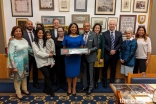 Naureen Karim Shariff joins family, friends, and colleagues for a group photo at the Freedom of the City of London award ceremony at The Guildhall in London.