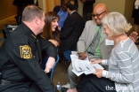 Police officers, clergy, educators, and community peacebuilders discuss implicit bias in group break-out sessions.