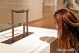 Shehrose Noormohamed, a Jubilee Heritage participant from Chicago, examines an 18th-century dagger and sheath at the Aga Khan Museum.