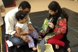 Parents play with their child during a Parwaaz early child development session. Ismaili Council for Pakistan