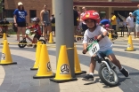 Pasha rounds a corner during a 2017 Strider Cup race on his balance bike. The Strider Cup is an international competition for children ages 2-5.