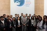 Prince Amyn at the Paris Peace Forum 2022 with volunteers from the community