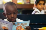 A student reading at the Aga Khan Academy Mombasa.