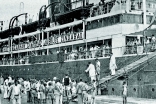 The chartered mailboat SS Vasna, flying the My Flag, which started in South Africa and brought thousands of Ismailis to Dar es Salaam. 