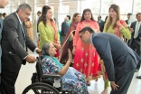 Mukhi Saheb Minhaz Lakhani wishes an elderly Jamati member. Leadership formed an honor guard to welcome the Jamat to the Diamond Jubilee Opening Ceremonies.