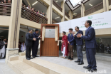 Princess Zahra, her son Iliyan, and guests reveal a plaque to commemorate the official opening of the Aga Khan Hostel in Sherqilla.