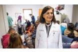 Dr. Gulshan Harjee with patients in her clinic.