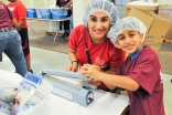  I-CERV volunteers and others packing nutritional packs in partnership with Feed My Starving Children, Chicago.