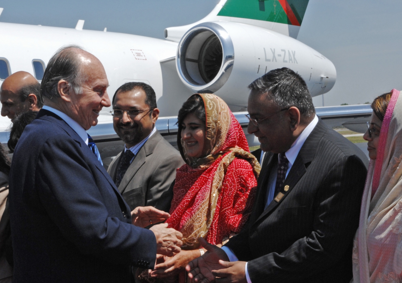 President Aziz Hashim of the Ismaili Council for Southeastern USA and President Iqbal Lakhani of the Ismaili Council for Florida welcome Mawlana Hazar Imam as he arrives in Atlanta. 