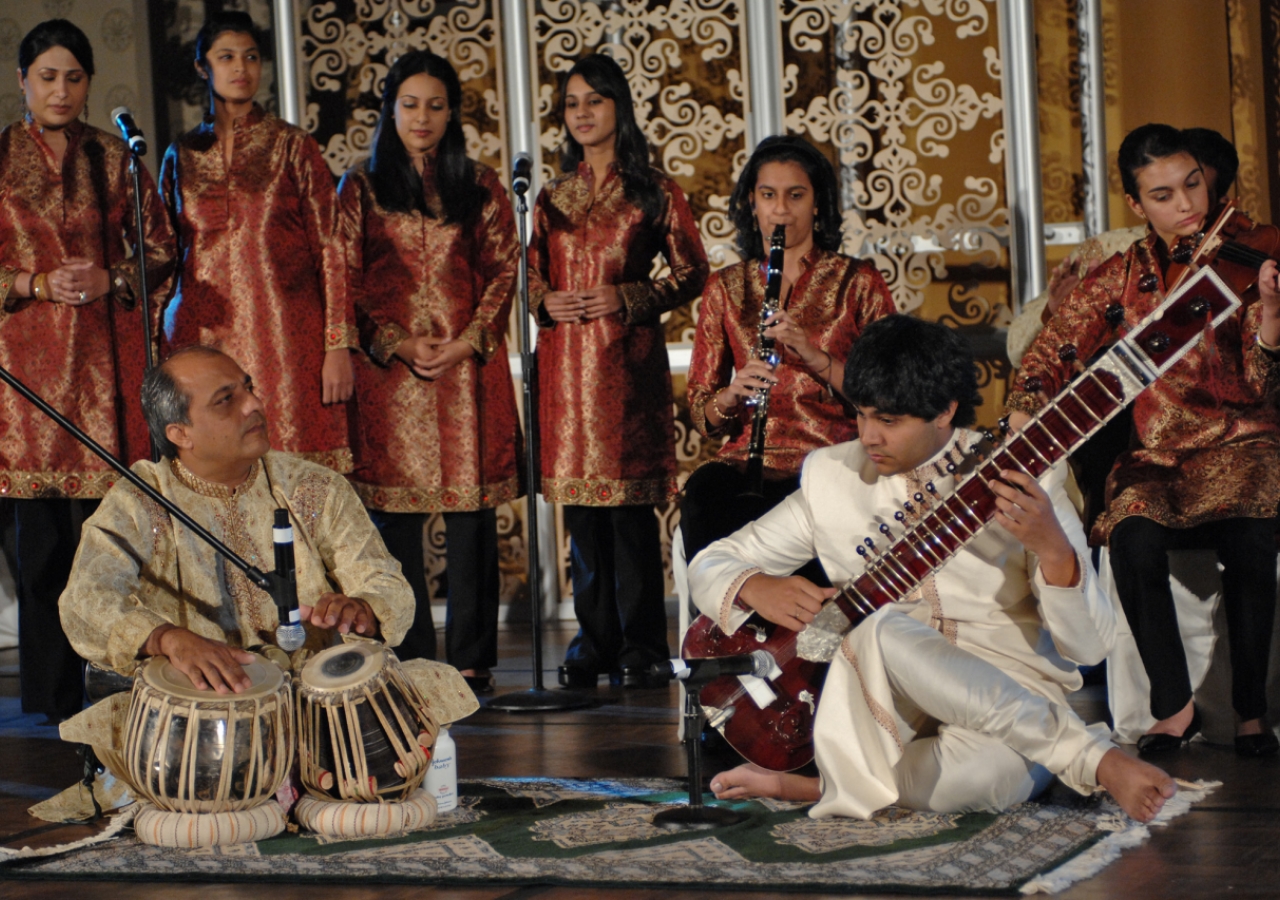 Talented musicians and singers from the USA Jamat performing a specially composed musical piece for Mawlana Hazar Imam at the Jamati institutional dinner. 