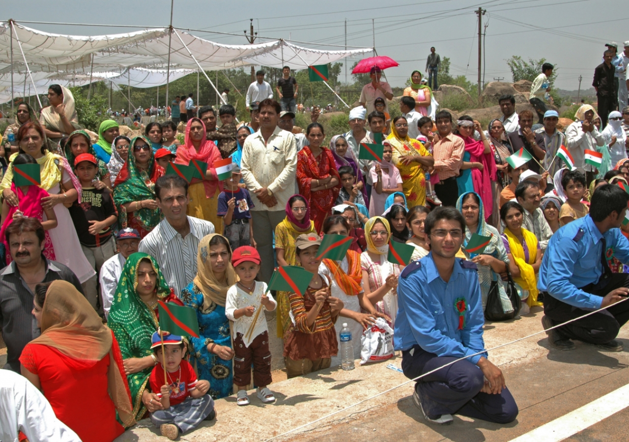 Members of the Jamat in Hyderabad line the streets around the airport in anticipation of Mawlana Hazar Imam's arrival.   