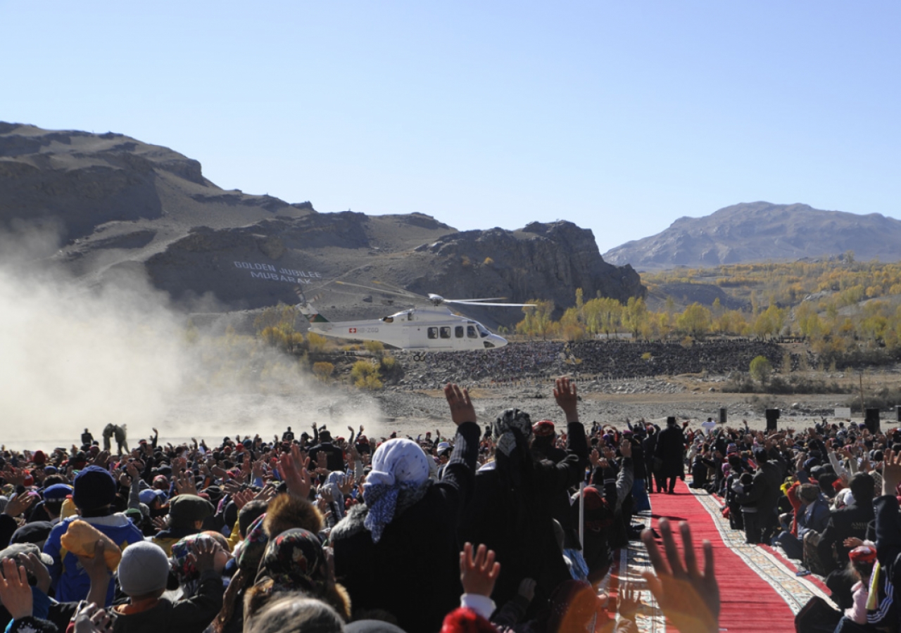 The Jamat waves, as Mawlana Hazar Imam’s helicopter prepares to depart, following the historic Golden Jubilee Darbar at Ishkashim.   