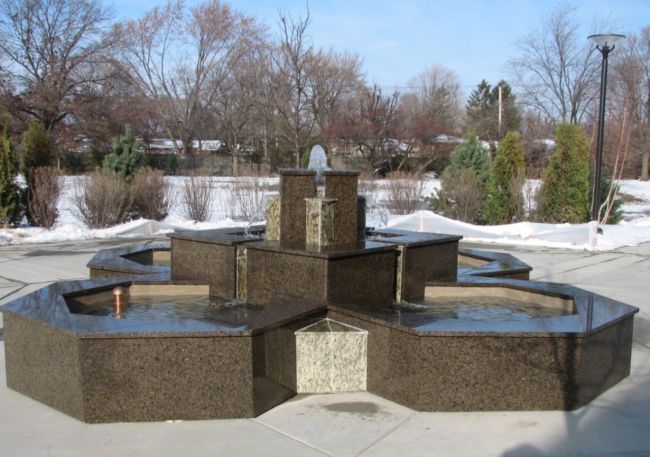 A fountain trickles in the garden outside the Jamatkhana.   