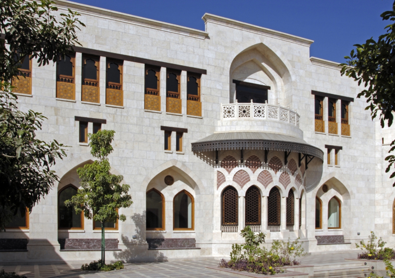 A façade of interspersed openings facing the courtyard.