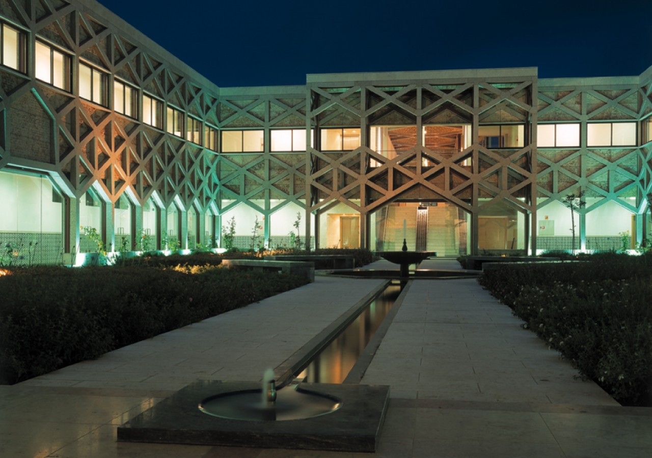 Cool water courses through the courtyard at dusk.