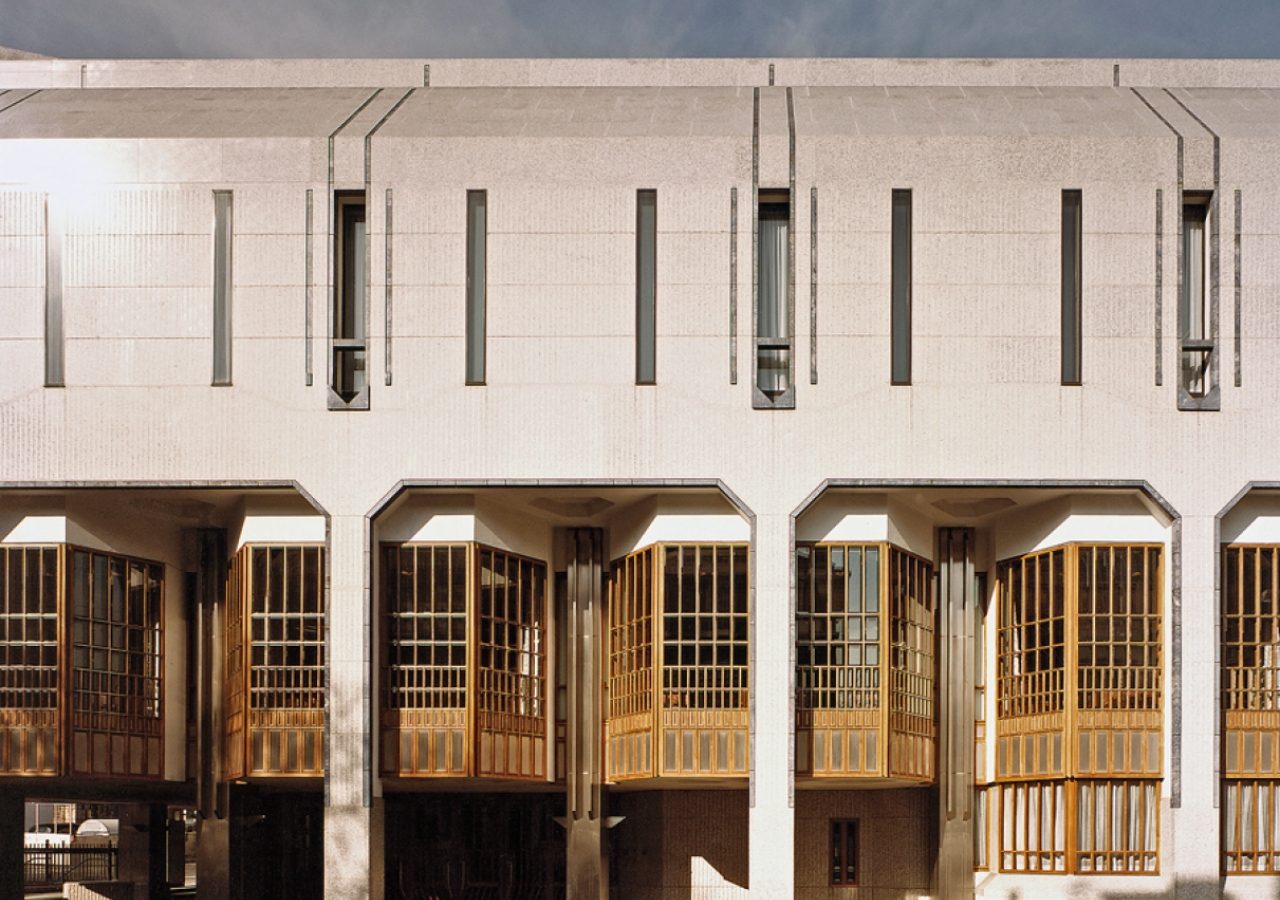 Detail showing windows and panels in stainless steel, teak and bevelled glass, with three different surface finishes to the granite.