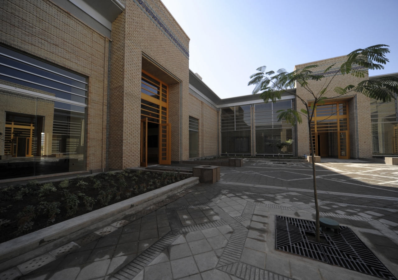 The Great Courtyard with the Social Hall Portal on the left and the Prayer Hall portal on the right. A reflection of the Youth and Education Portal is visible in the window of the Social Hall.