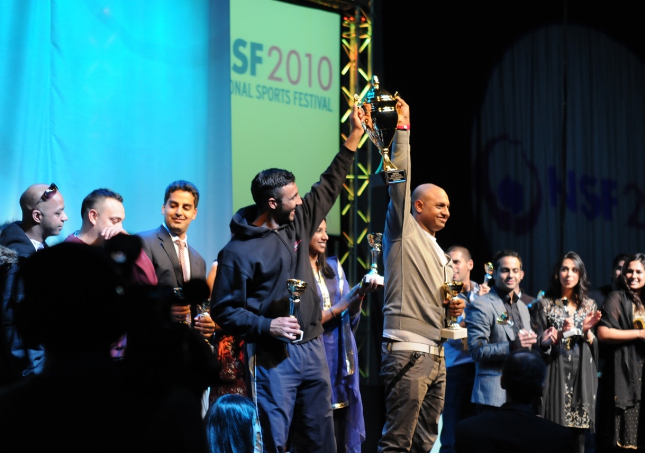 International Volleyball winners receive their trophy.