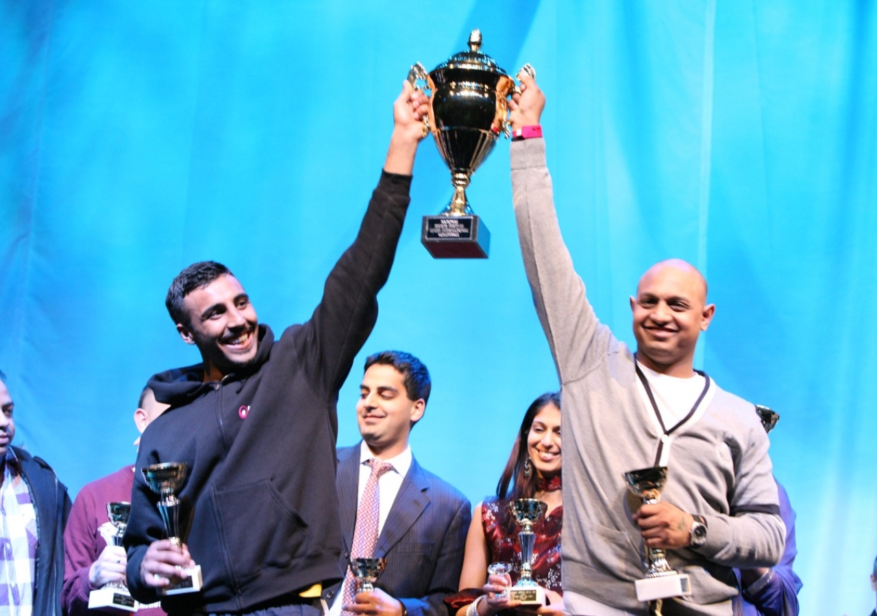 International Volleyball winners receive their trophy.