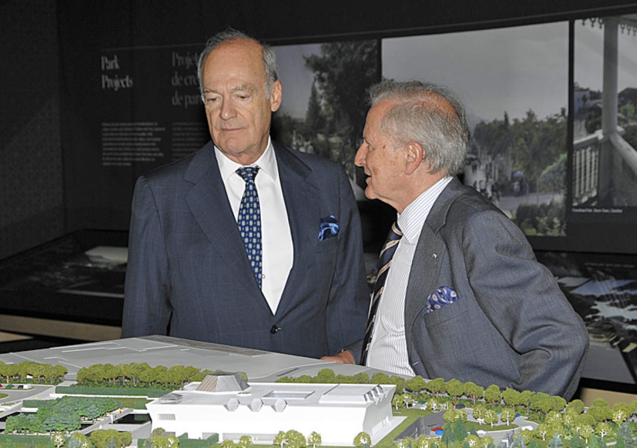 Prince Amyn and Luis Monreal, General Manager of the Aga Khan Trust for Culture, discuss the architectural model of the Ismaili Centre, the Aga Khan Museum and their Park.