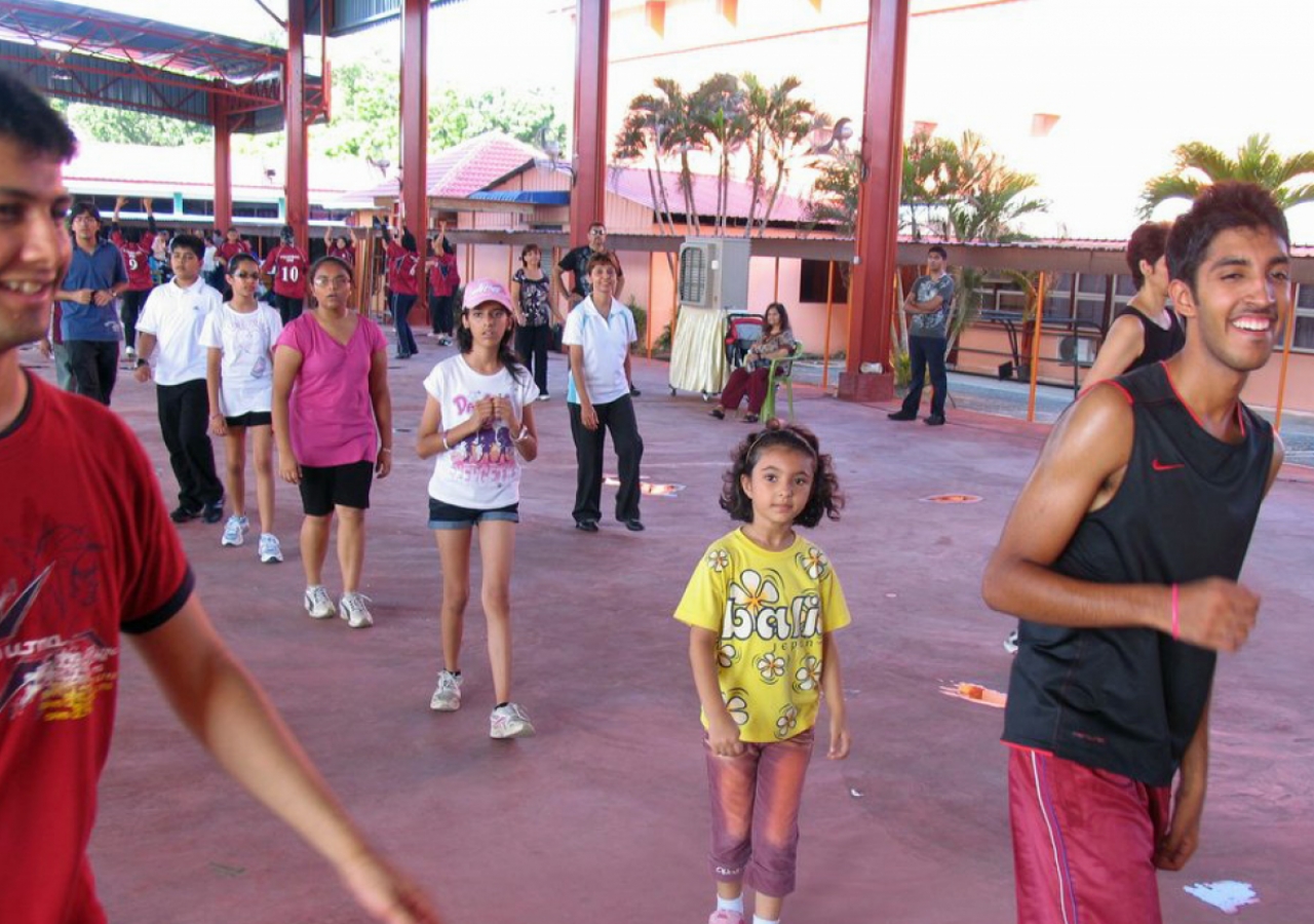 Participants join in a warm-up session ahead of the Sports Day&amp;rsquo;s main events.