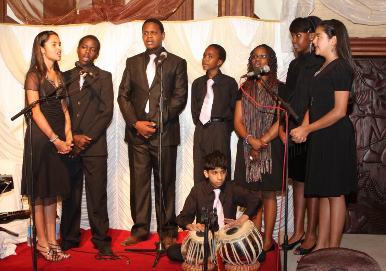 Students from the Aga Khan Academy, Nairobi perform an interfaith chant before Mawlana Hazar Imam at the Kenya Jamati Institutional Dinner.