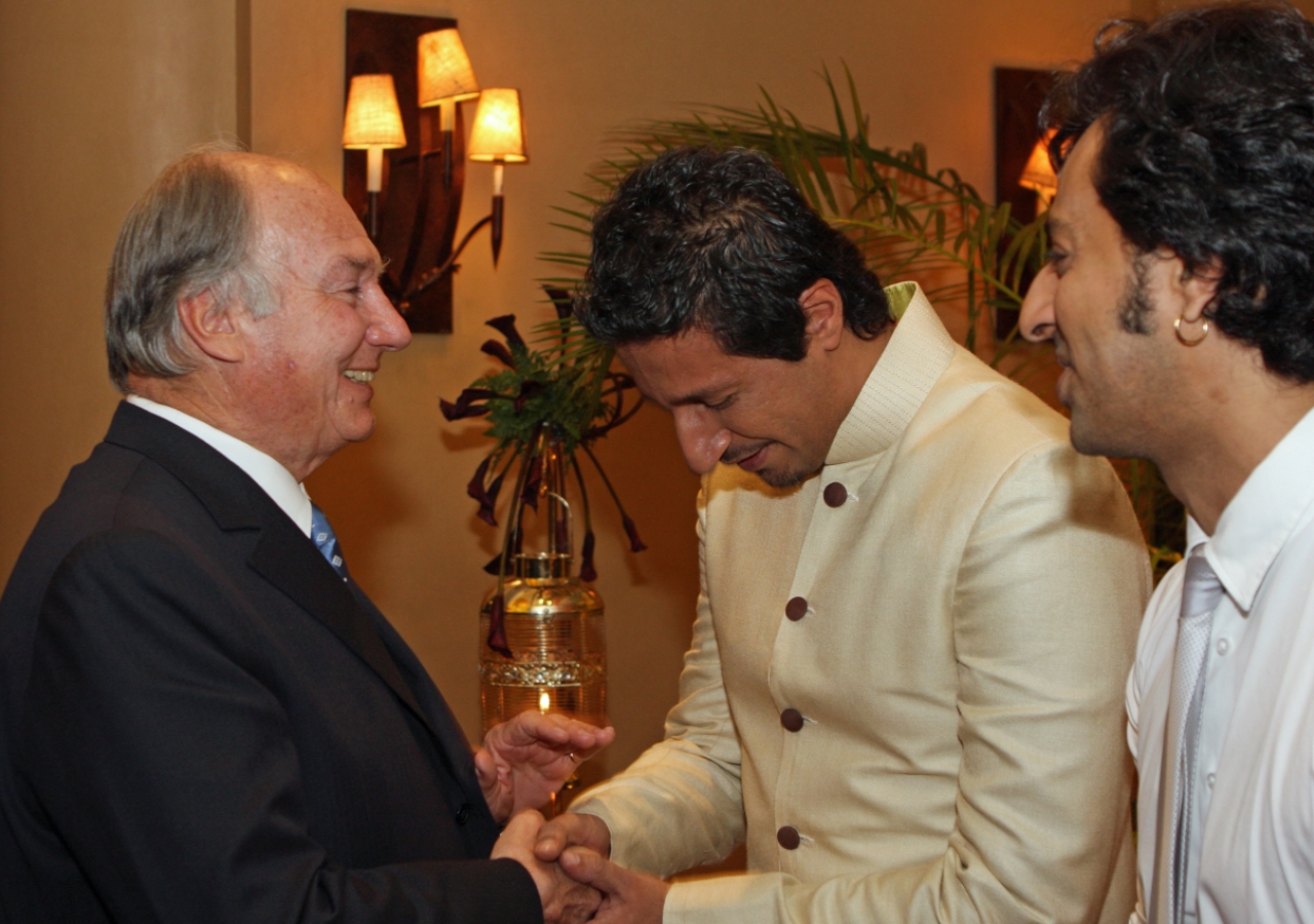 Mawlana Hazar Imam with music artists Salim and Sulaiman Merchant, who performed in his honour at the Kenya Jamati Institutional Dinner.