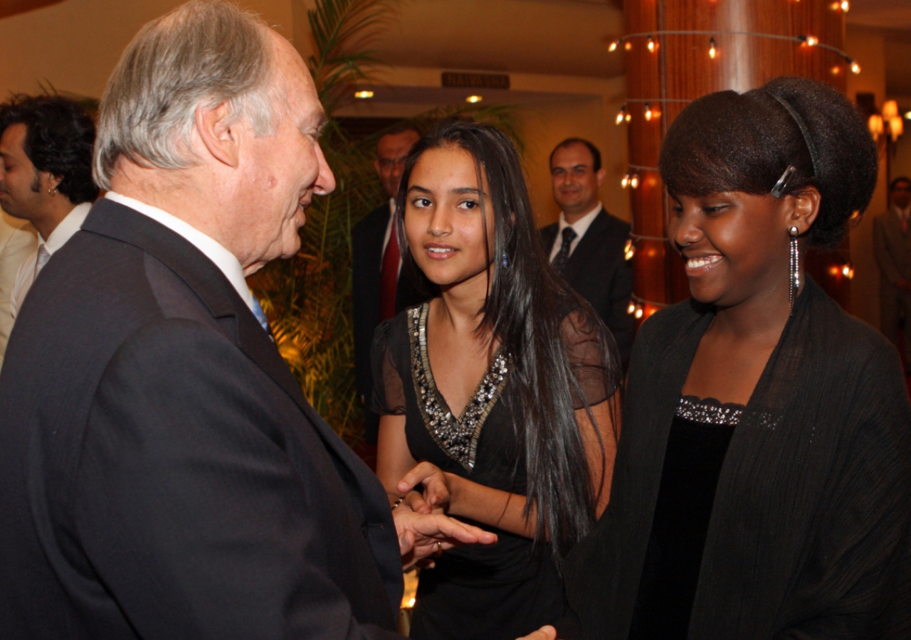 Mawlana Hazar Imam greets performers from the Aga Khan Academy, Nairobi, following the Jamati Institutional Dinner.