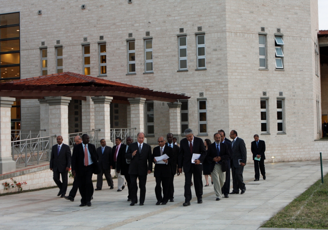 Mawlana Hazar Imam walks through the campus of the Aga Khan Academy, Mombasa accompanied by senior staff and architects.