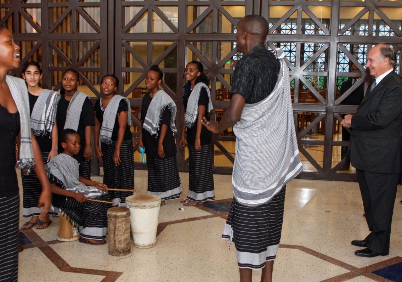 Mawlana Hazar Imam takes in a performance by members of the choir at the Aga Khan Academy, Mombasa.