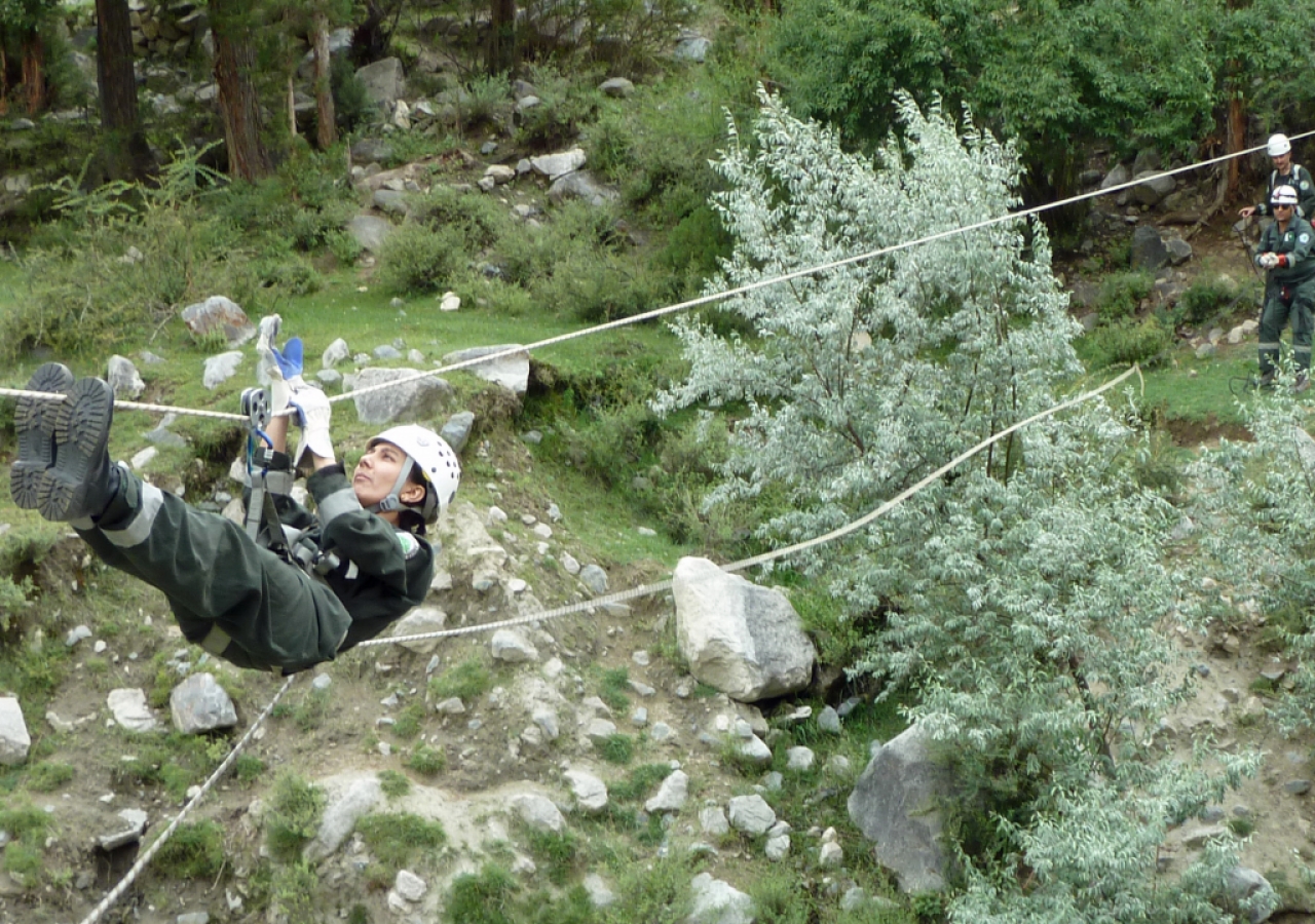 Fauzia of the FOCUS Search and Rescue Team, Gilgit demonstrates an evacuation technique.