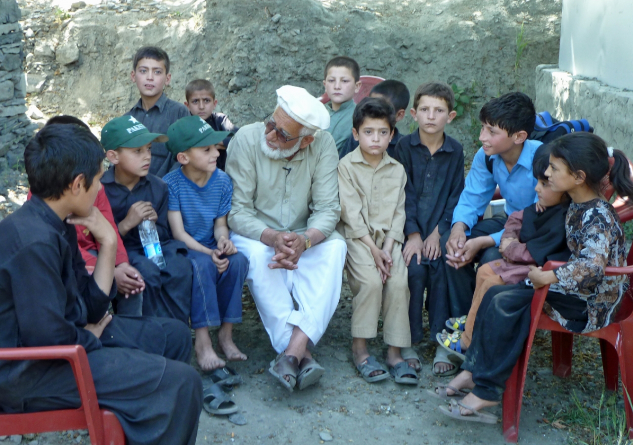 Rehmat Ghafoor Baig is seen with Faizan Arfeen along with other village children, some of whom were traumatised by the floods.