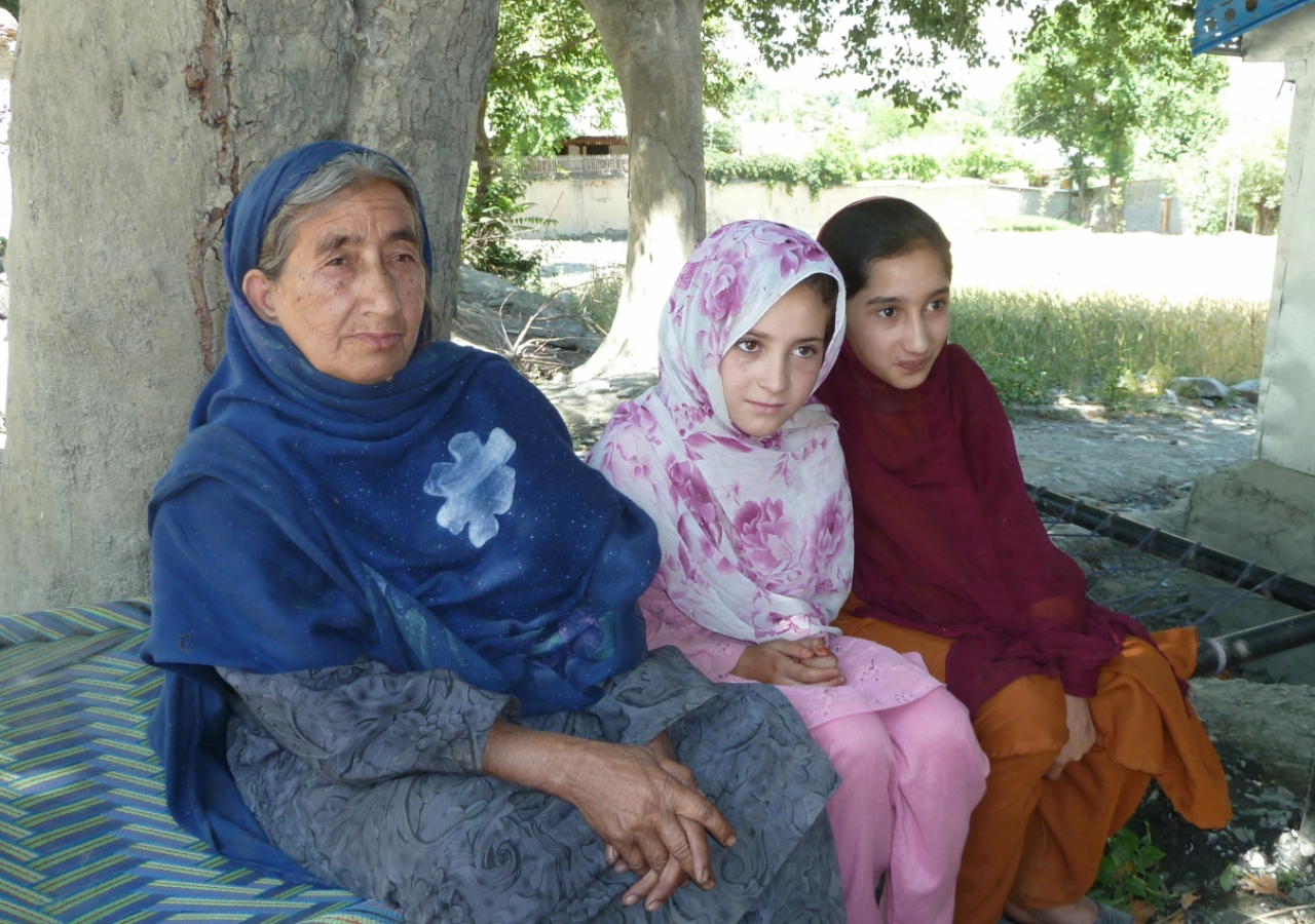 Sultan Bibi from Uchushti village in Chitral, Khyber Pakhtunkhwa is seen sitting with village girls. She survived the floods but lost her 25-year-old son and 19-year-old daughter to the raging waters.