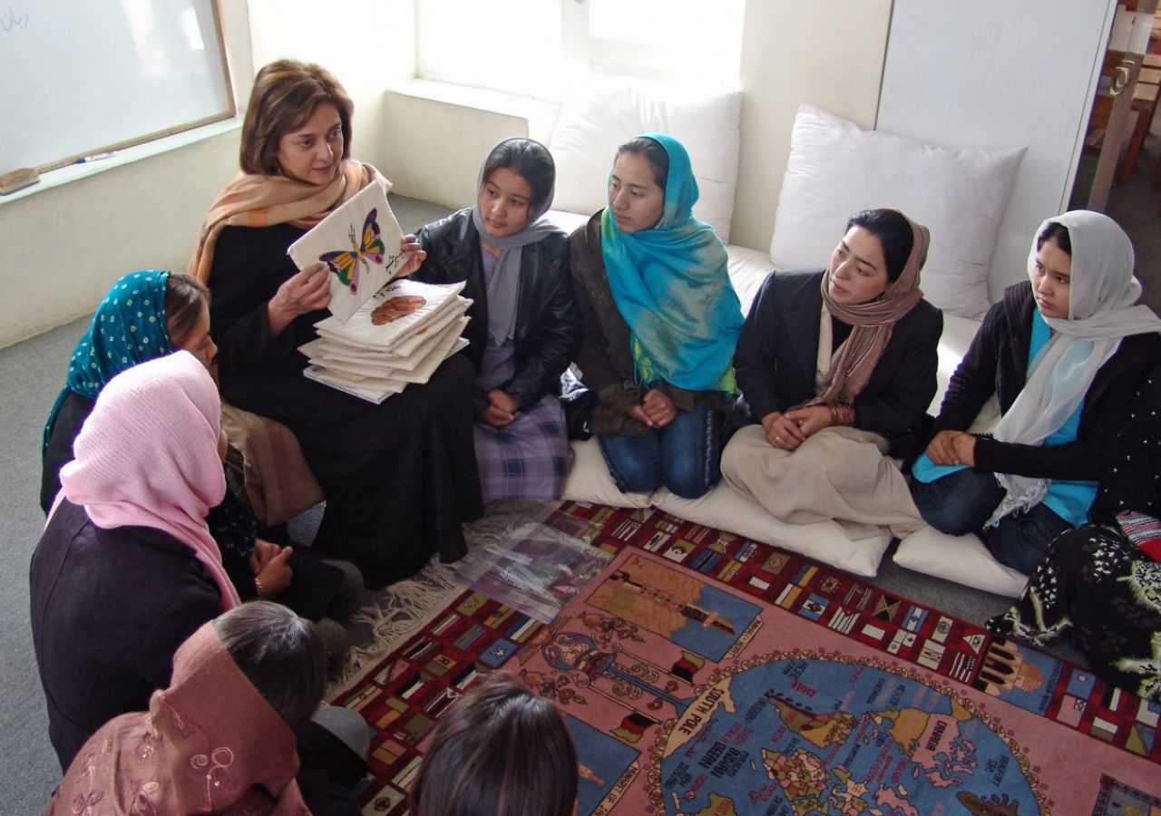 Roshan Thomas uses materials sewn by mothers to train a group of teachers at a new Early Childhood Development centre in Kabul.