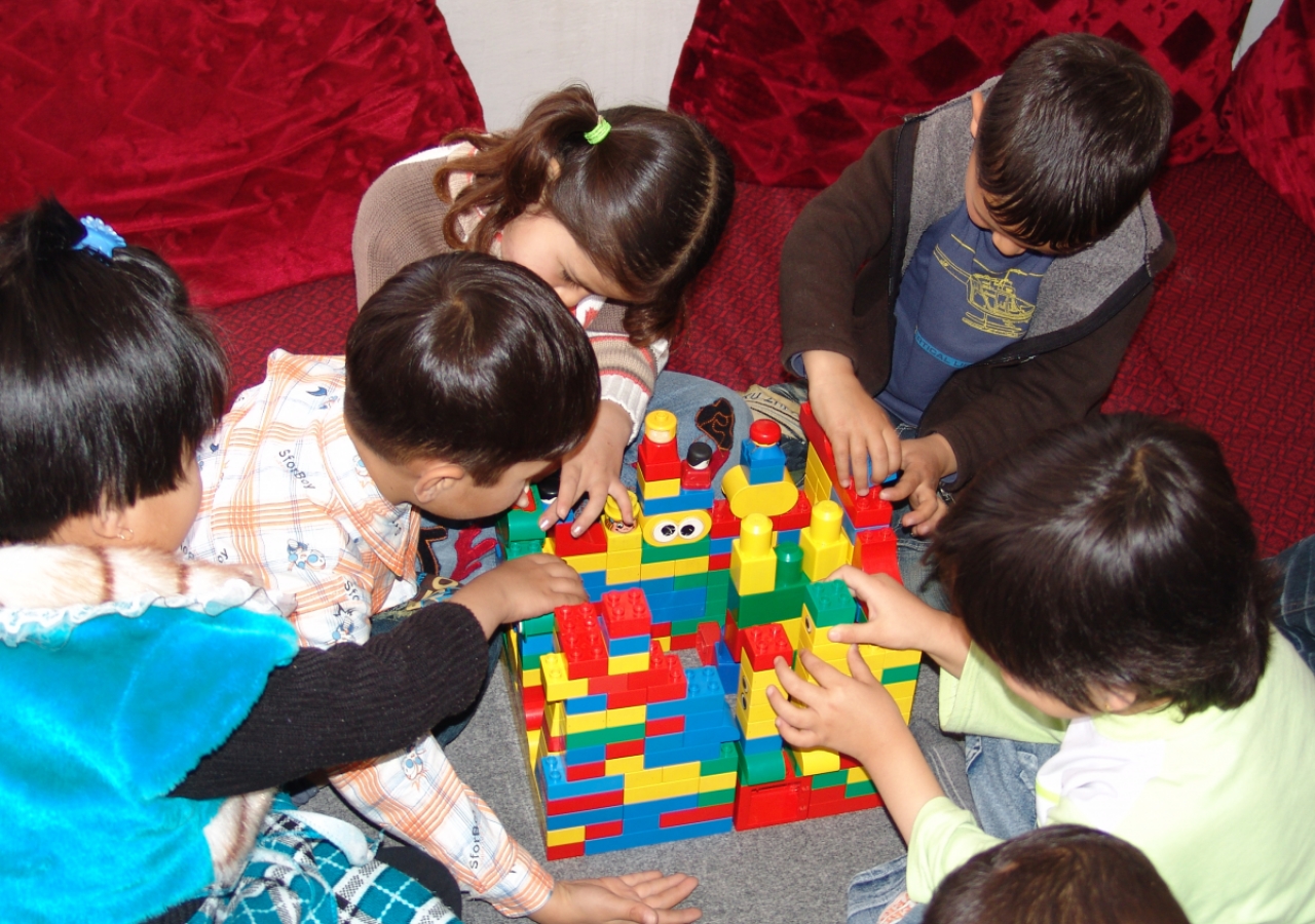 Three-year-olds play with universally loved blocks at Sparks Academy in Kabul.