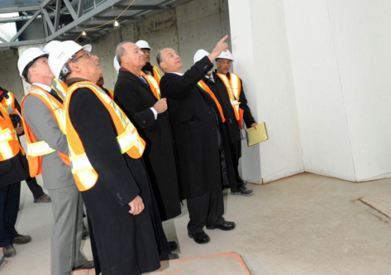 Mawlana Hazar Imam and Prince Amyn in the prayer hall of the Ismaili Centre, Toronto, discussing design details of the mihrab.