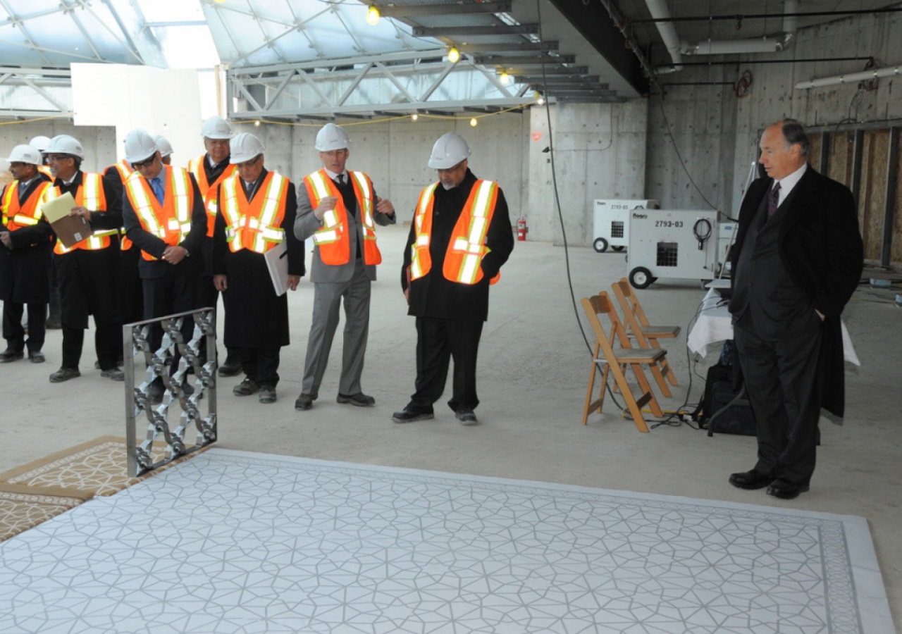 Mawlana Hazar Imam and the Oversight Committee consider the carpet selection for the Jamatkhana.