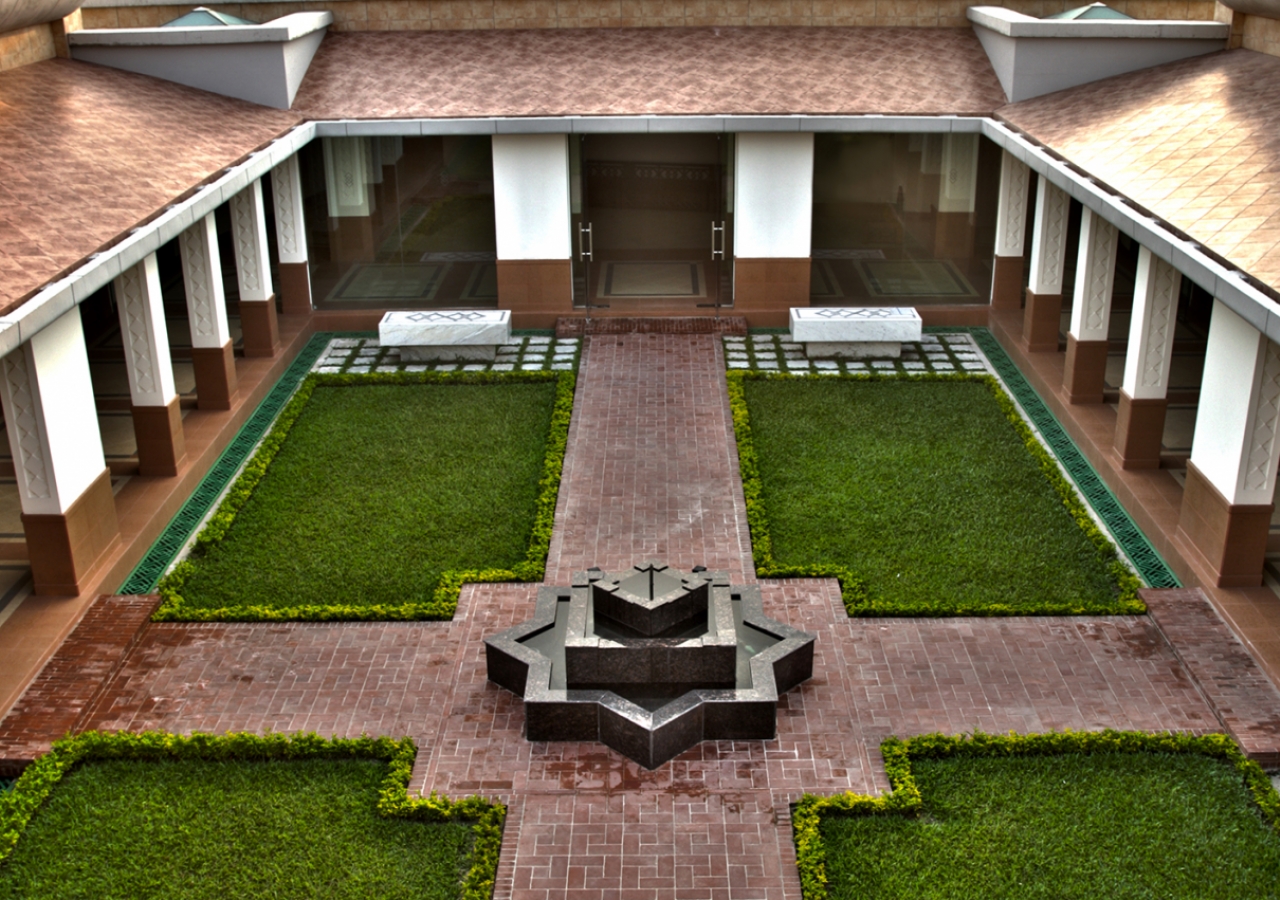 Functional areas of the building are arranged around the Centre Courtyard with the Social Hall on the right, the Administrative Corridor on the left, and the Prayer Hall in the front.