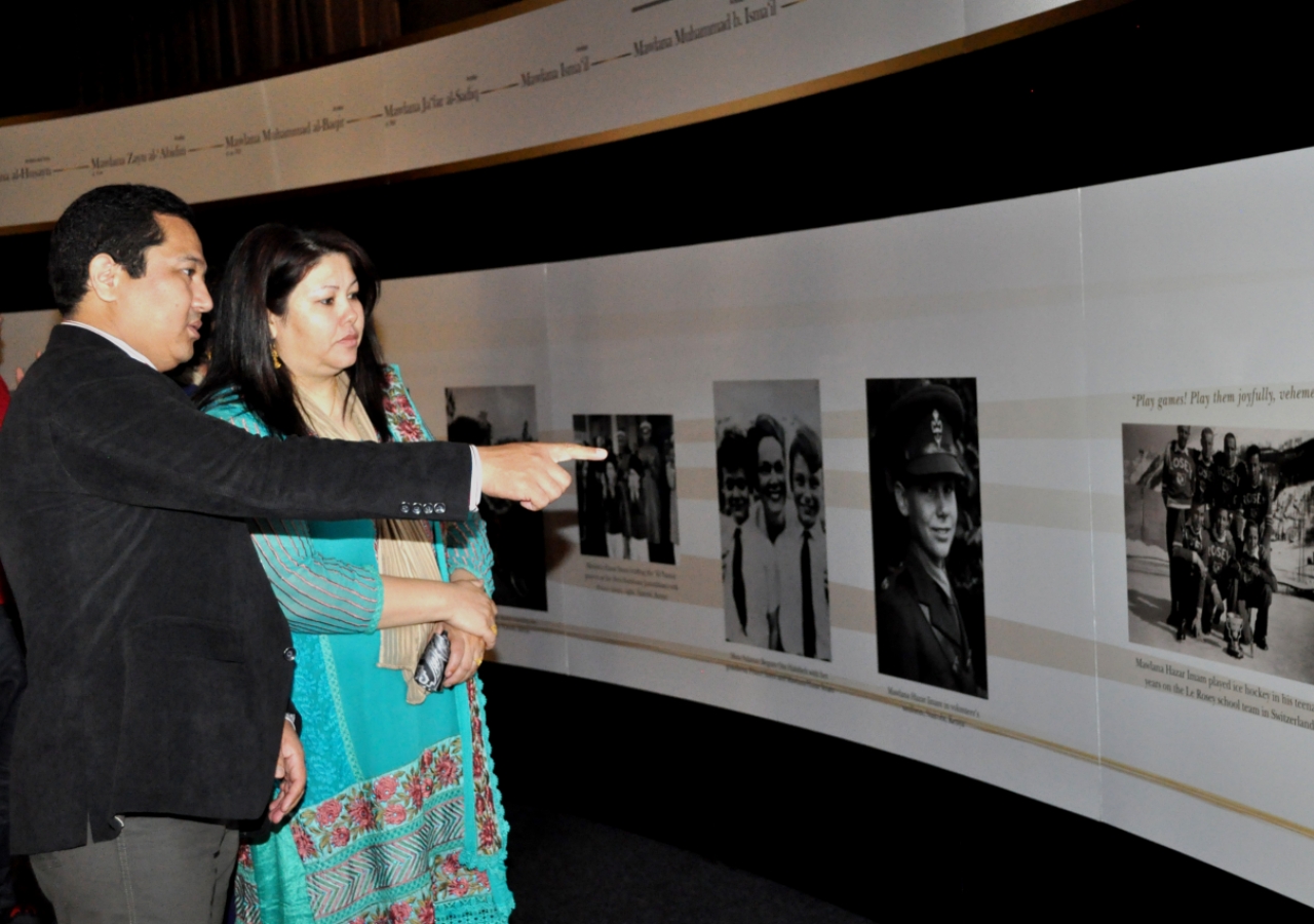 RAYS OF LIGHT visitors take in photographs spanning Mawlana Hazar Imam&amp;rsquo;s life and his work during the first fifty years of his Imamat.