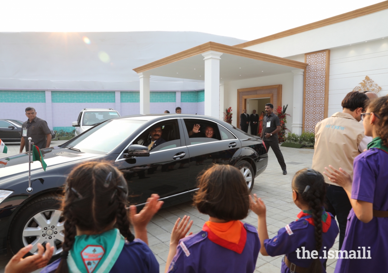 Ismaili cub-scouts and bulbul-guides line the street as Mawlana Hazar Imam departs the Darbar hall in Mumbai.