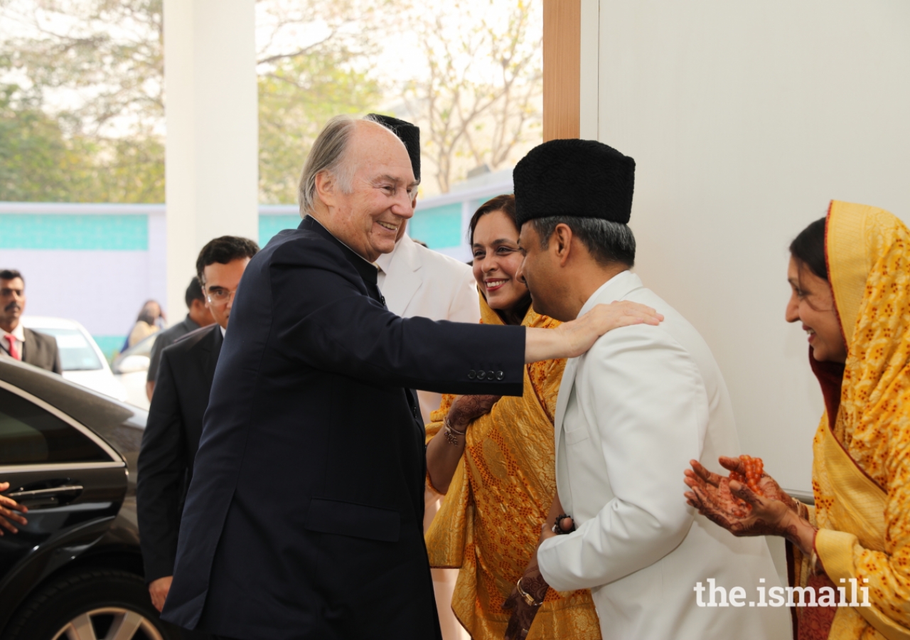 Mawlana Hazar Imam is received by Mukhi Saheb, Mukhiani Saheba, Kamadia Saheb, and Kamadiani Saheba at the Darbar Hall in Mumbai.