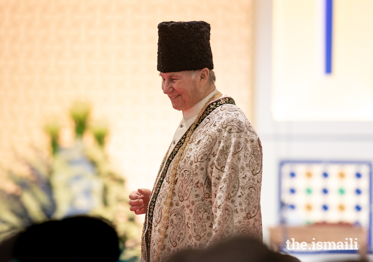 Mawlana Hazar Imam walks through the Jamat during the Diamond Jubilee Darbar in London.