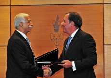 Professor Manuel Braga da Cruz and Firoz Rasul exchange agreements after the signing of the Memorandum of Understanding between the Catholic University of Portugal and the Aga Khan University. 