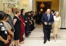 Flanked by Baroness Margaret Thatcher, former British Prime Minister, Mawlana Hazar Imam bids farewell to volunteers after the Imamat Dinner, London, 3 July 2008.