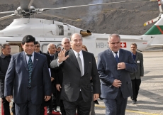 Accompanied by First Deputy Prime Minister Ghulomov and Governor Qosim of Gorno-Badakhshan, Mawlana Hazar Imam waves at the assembled Jamat upon his arrival in Khorog.   