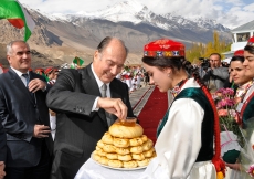 Against a picturesque background of snowy Pamir mountain peaks, Mawlana Hazar Imam is welcomed to Gorno-Badakhshan with a traditional offering of non (bread).  